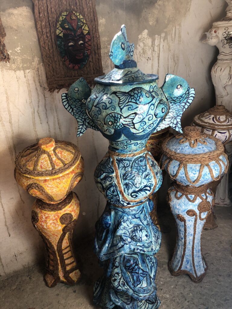 Color photograph of paper mache urns.